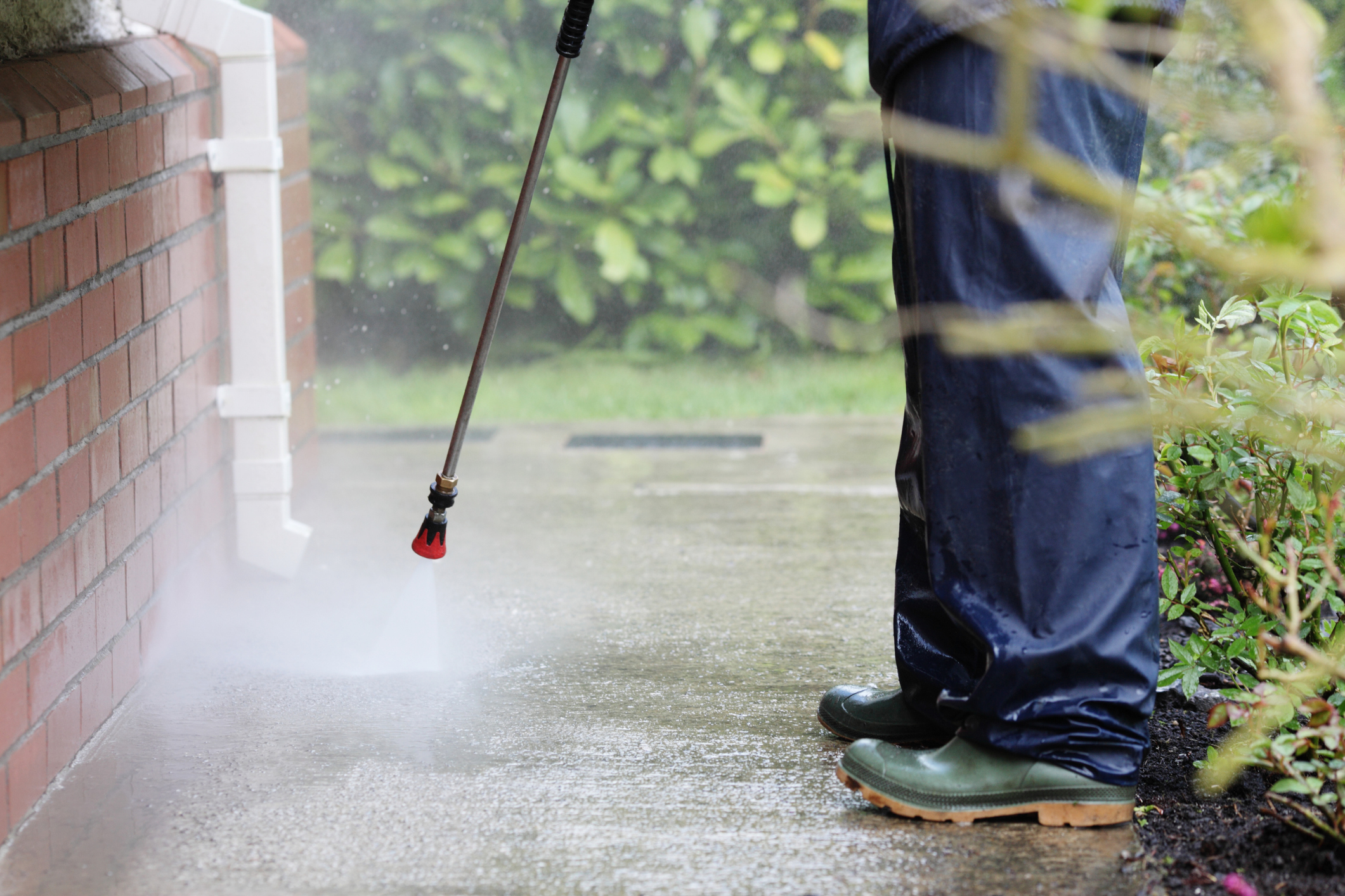 the best pressure washing company in raleigh, durham, and chapel hill power washing a driveway