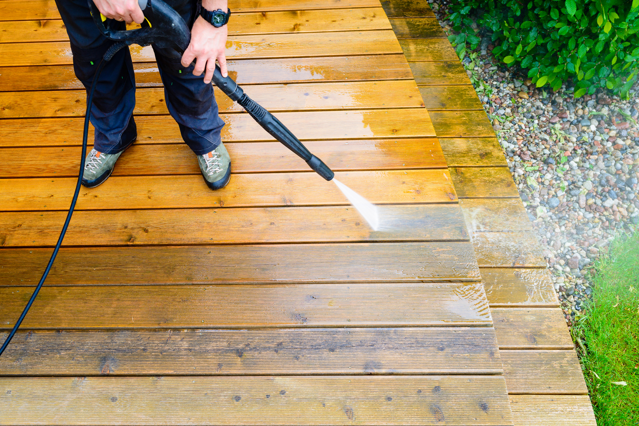 the best pressure washing company in raleigh, durham, and chapel hill power washing a deck